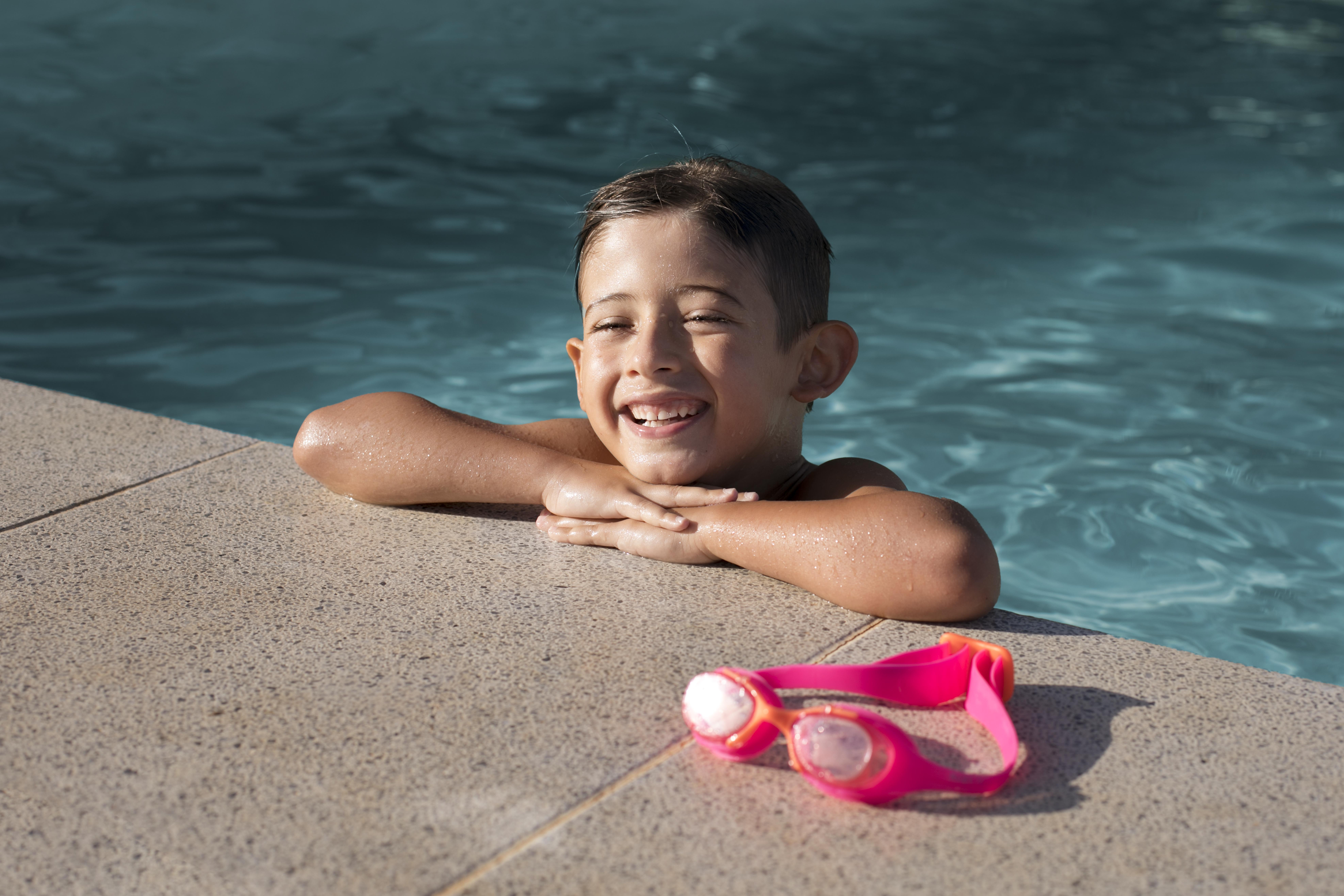 child smiling in pool 