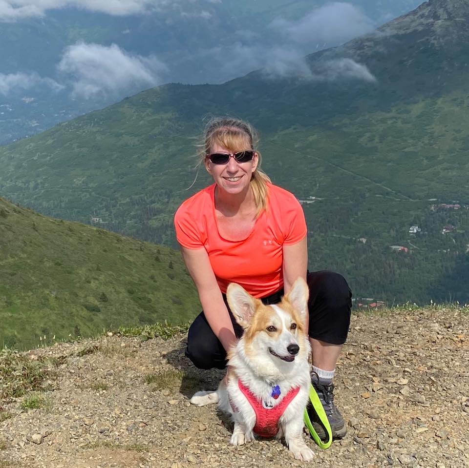 Janet Warner with her dog hiking in the mountains of Anchorage Alaska