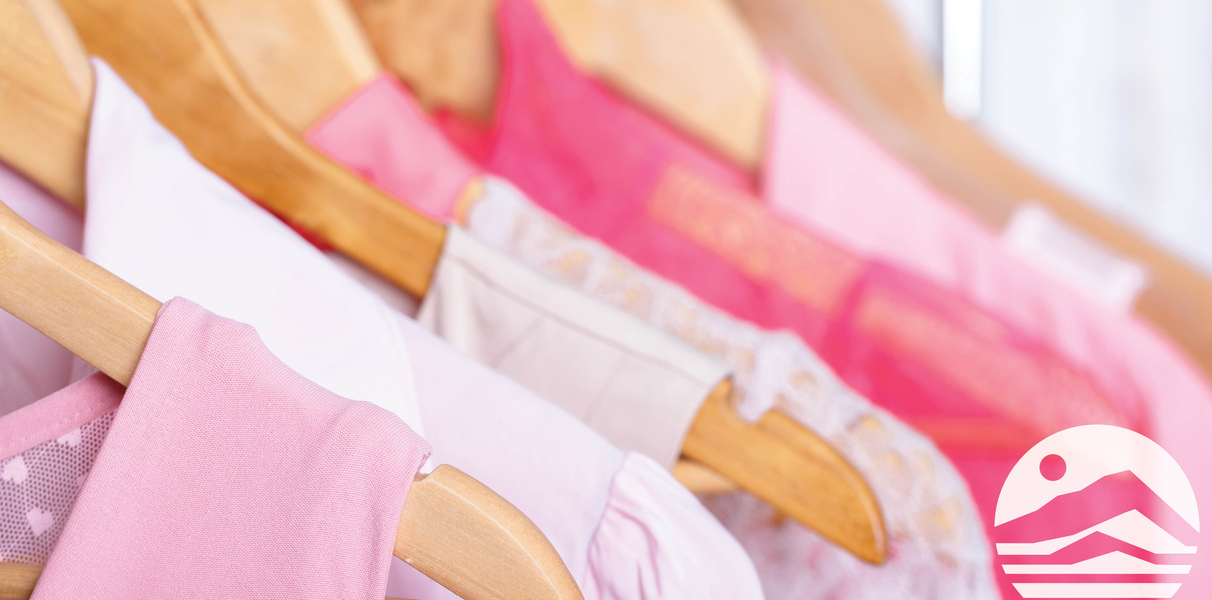 pink shirts on hangers