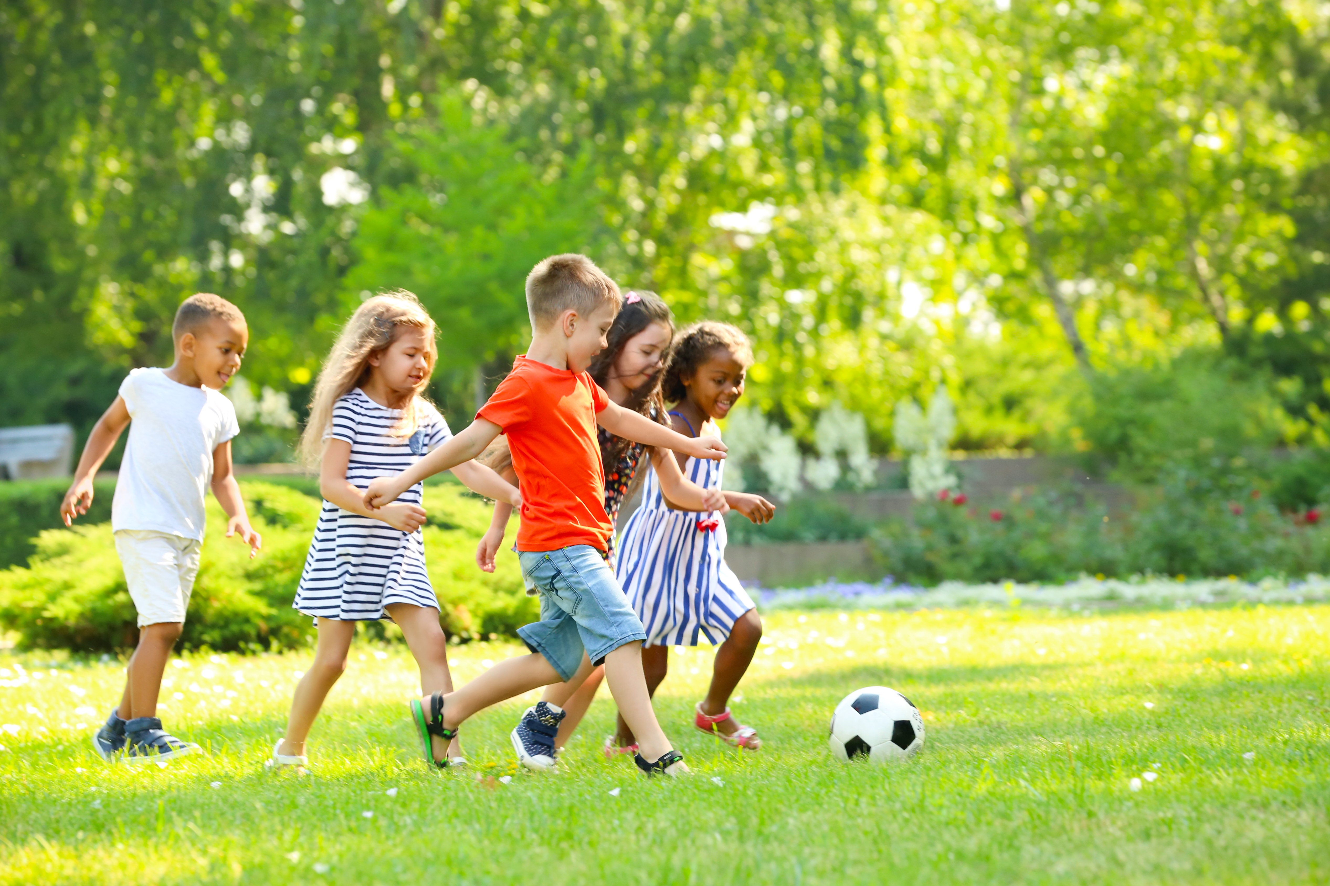 kids playing soccer outside